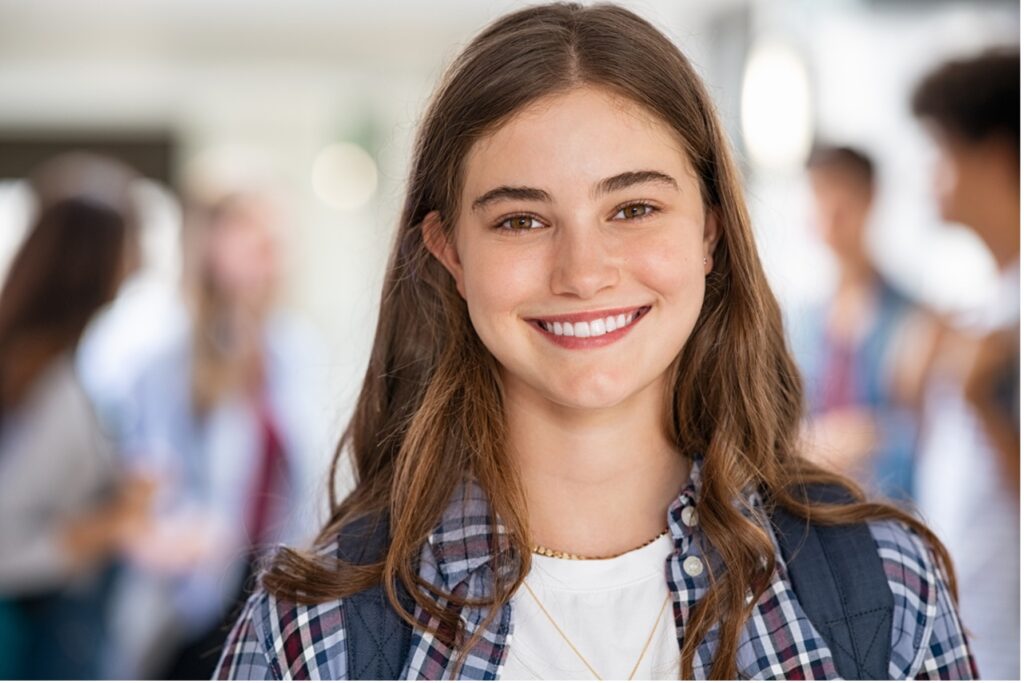 A person smiling at camera, Choosing In-Person Orthodontic Care for a Confident Smile
