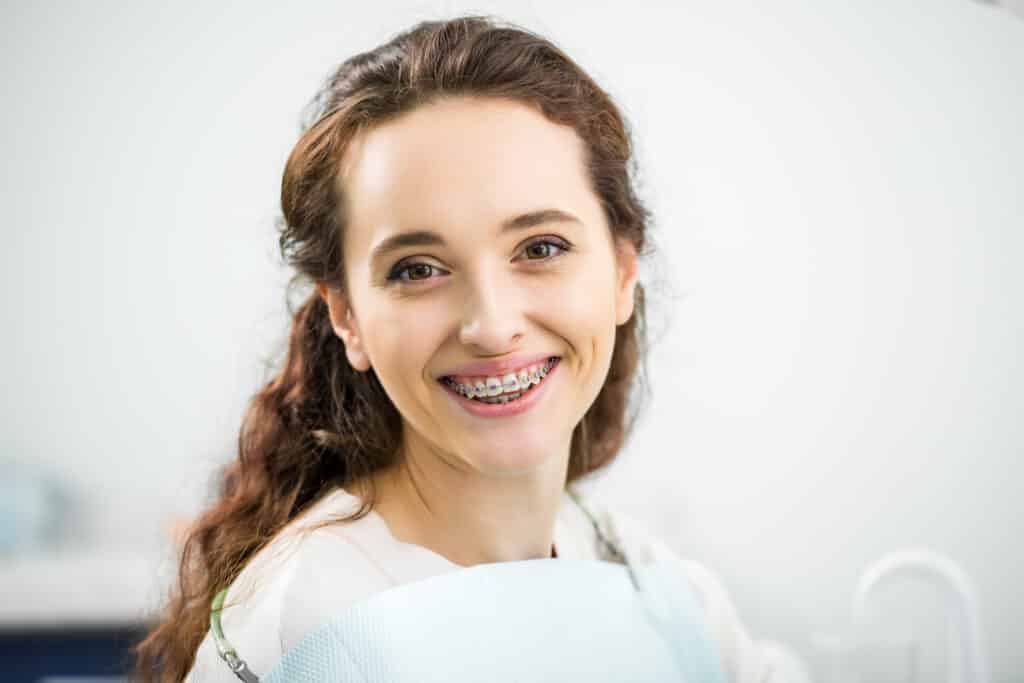 Adult Braces in St. George, UT: A Confident Smile at Any Age, A beautiful woman with braces smiling
