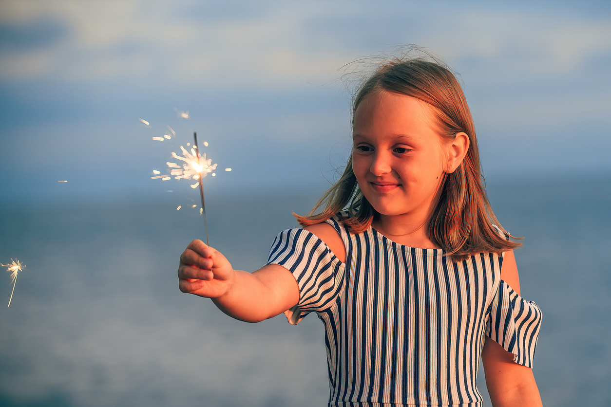 Early Orthodontic Care in St. George, A child holding a sparkler